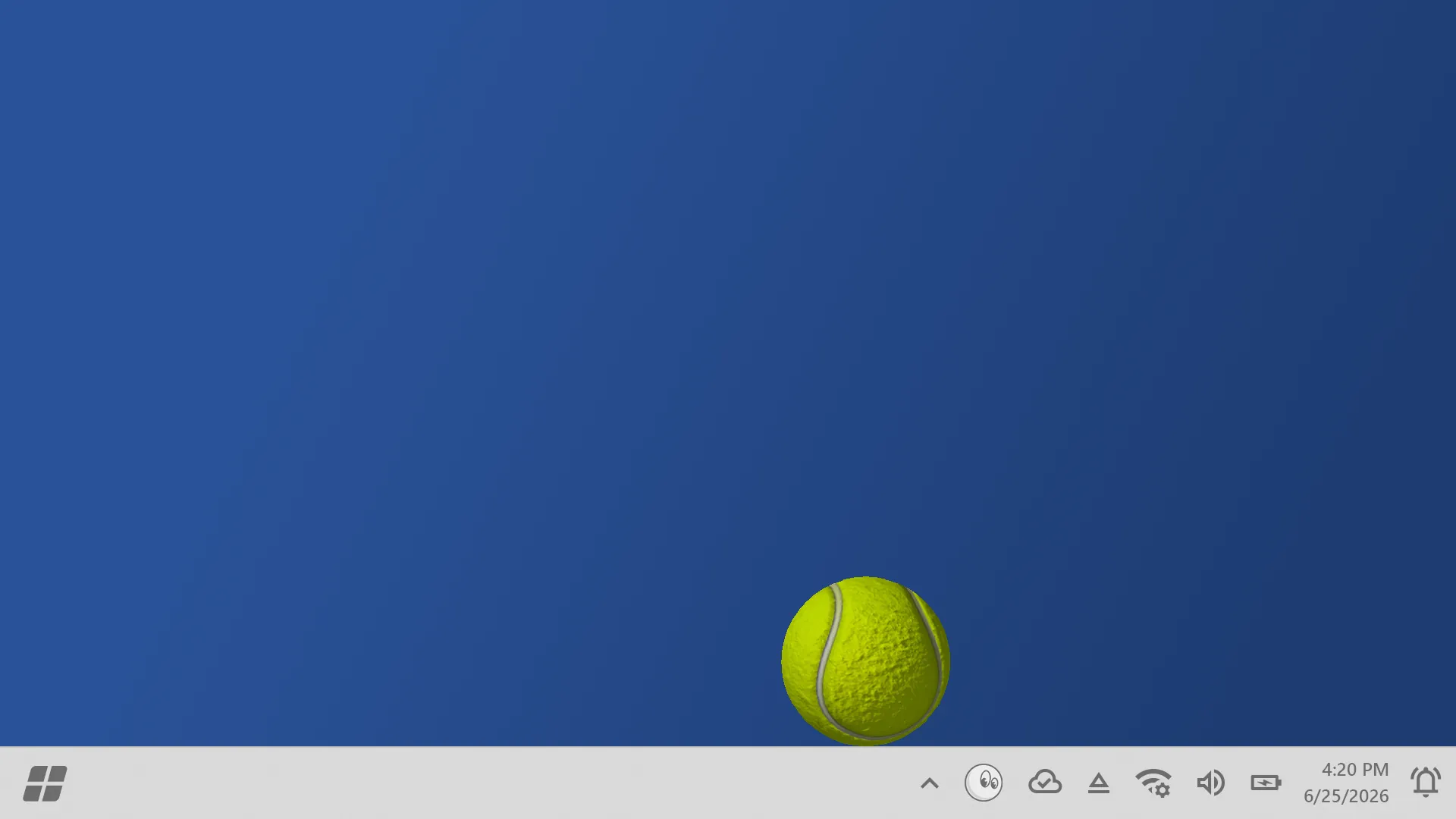 A tennis ball perched on the Windows taskbar